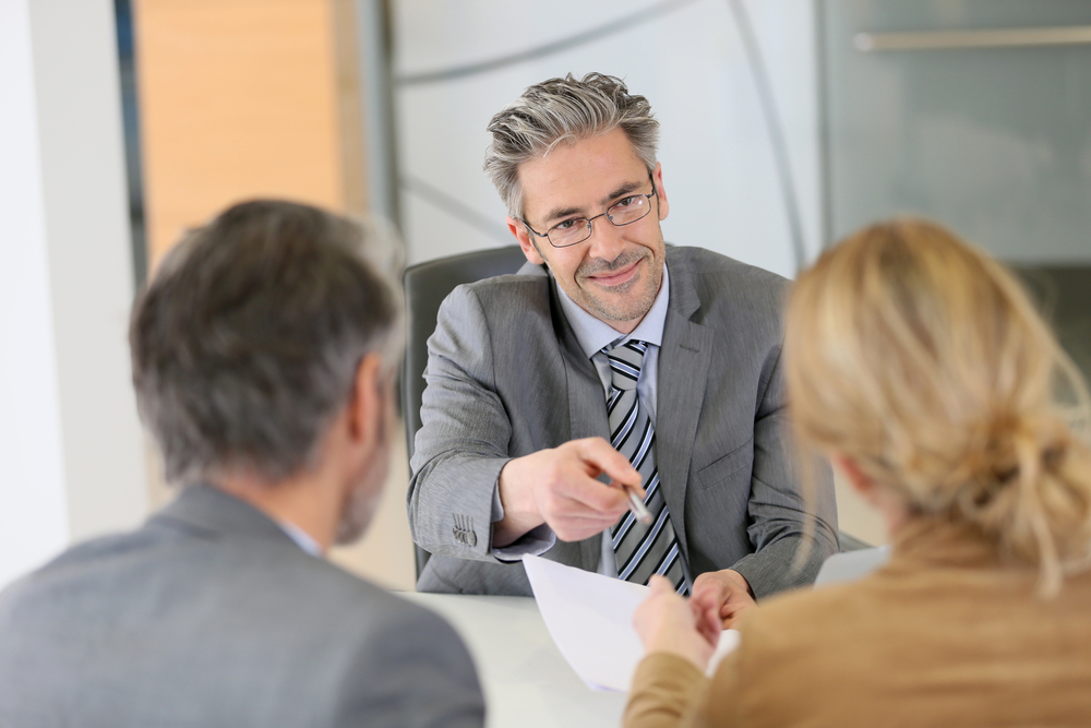 Financial planner with clients